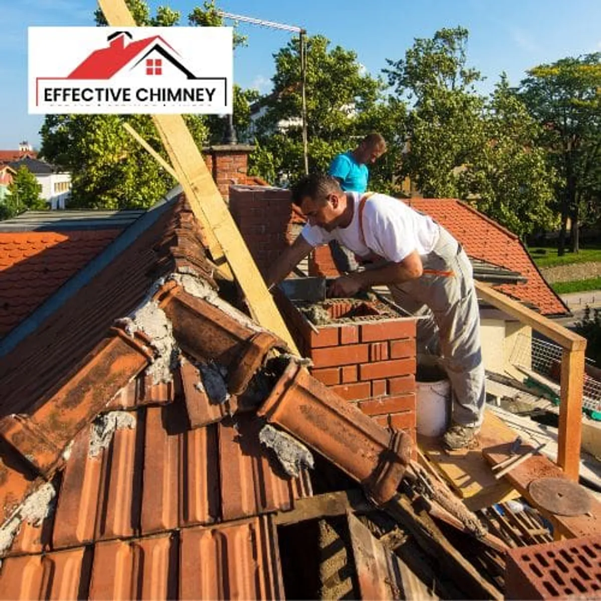 Brick chimney reconstruction beside a roof