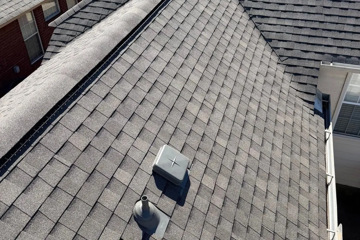 Shingle roof junction and vent detail