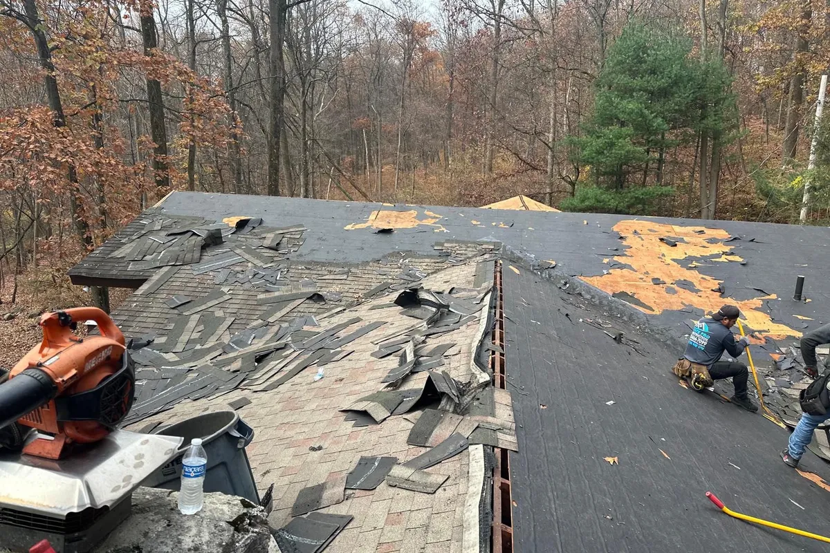 Roof covering removal and exposed decking during work