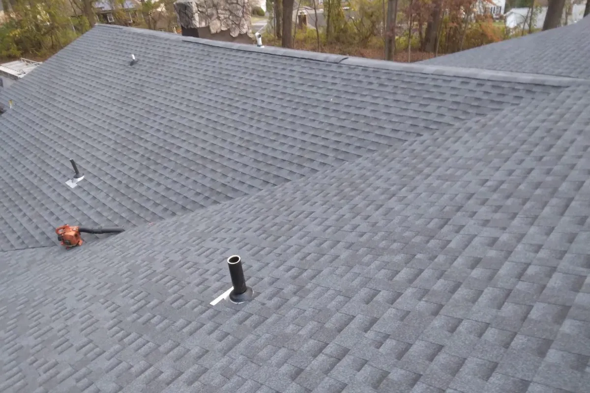 Shingle roof surfaces and pipe penetrations
