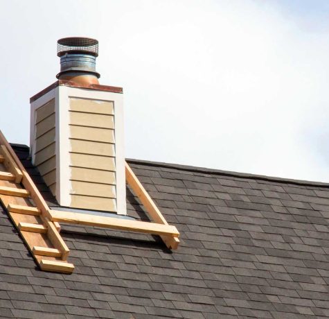 Close-up view of chimney flashing installed to prevent roof leaks.