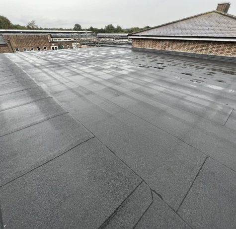 Commercial flat roof with membrane installation.