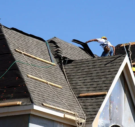 Old shingles being removed during roof replacement.