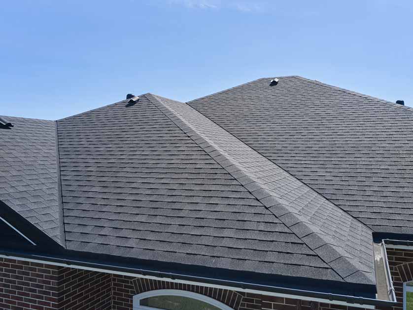 Homeowner reviewing roof warranty documents.