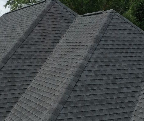 Contractor reviewing roofing permit documents.