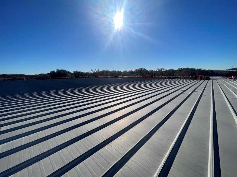 Commercial metal roofing panels installed on an industrial building in New Jersey by Effective Roof.